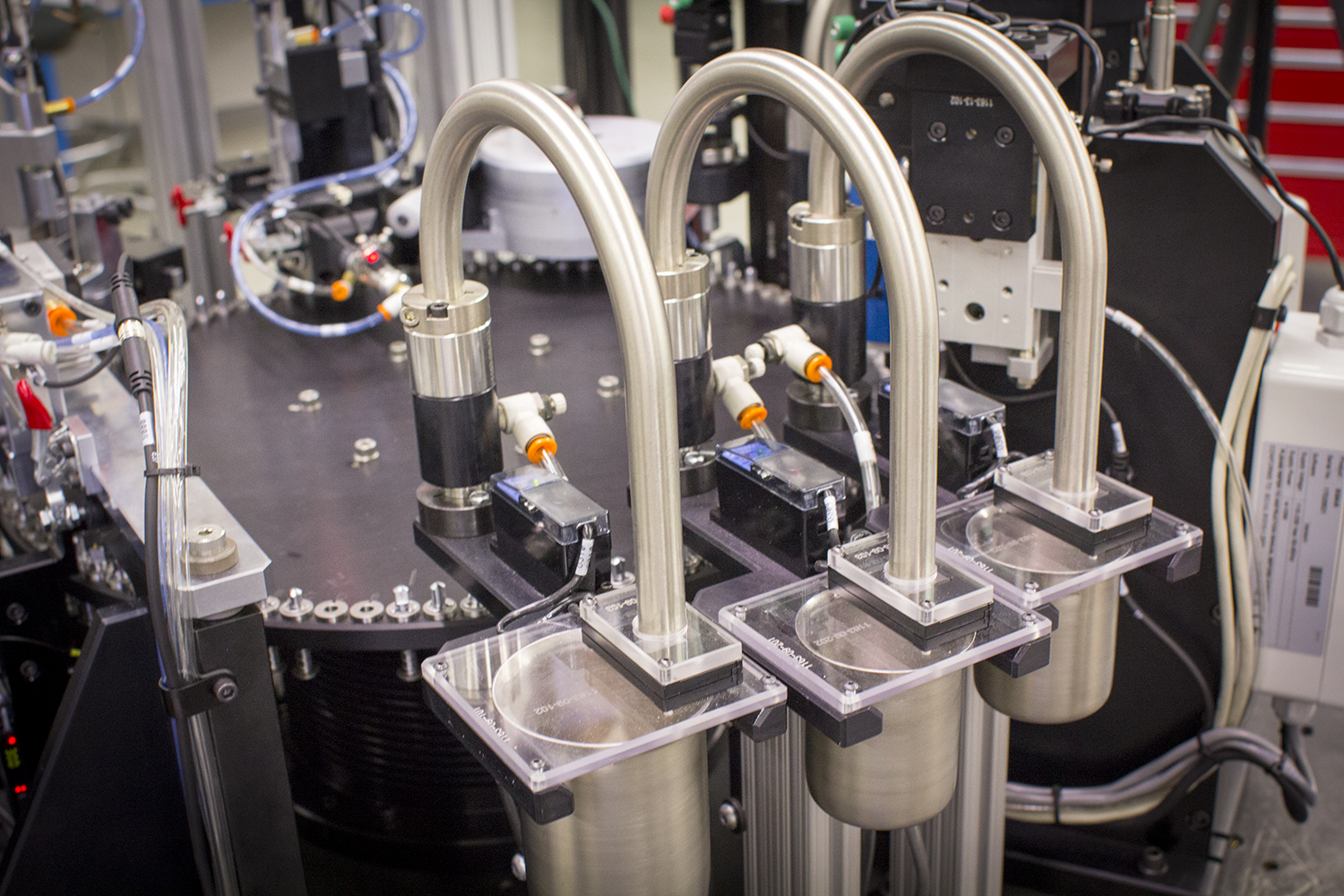 Multi-station electronic component assembly automation